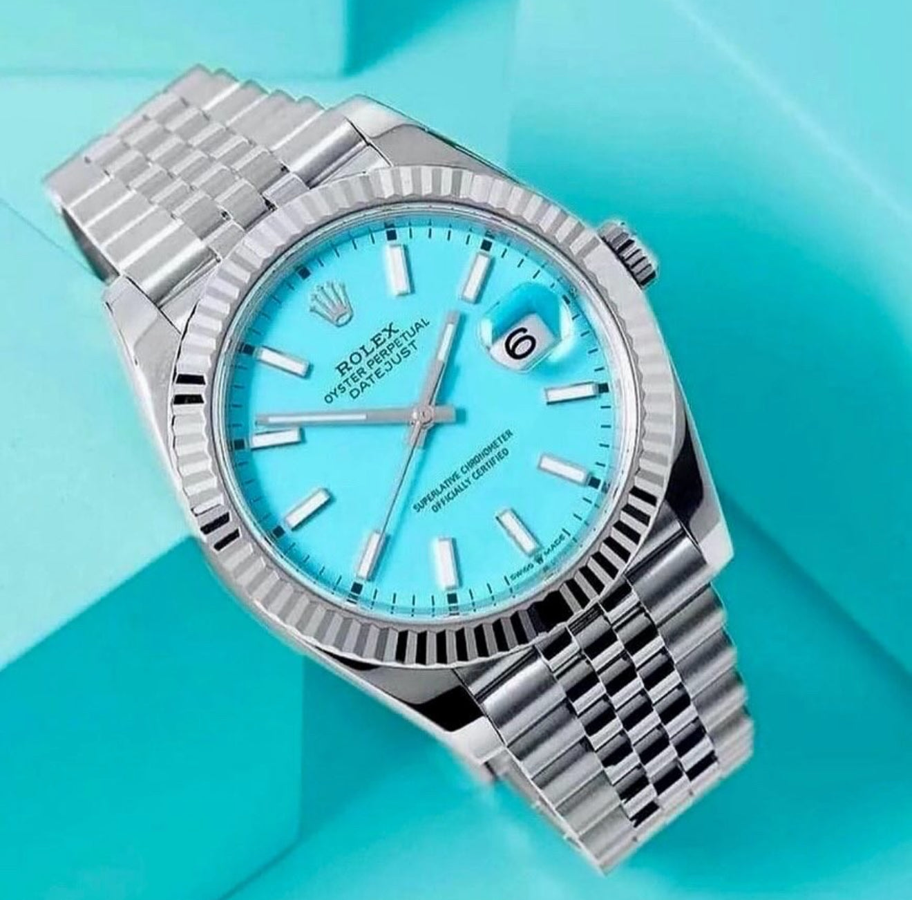 Datejust 41 with a custom turquoise "Tiffany" index dial, a white gold fluted bezel, and a stainless steel Jubilee bracelet.